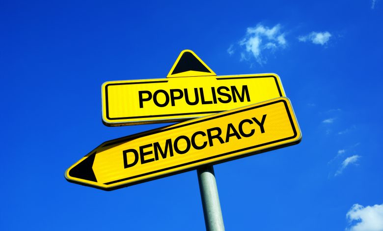 Populism vs Democracy - Traffic sign with two options - voting for establishment and mainstream democratical party vs electing demagogical populist politicians and politics