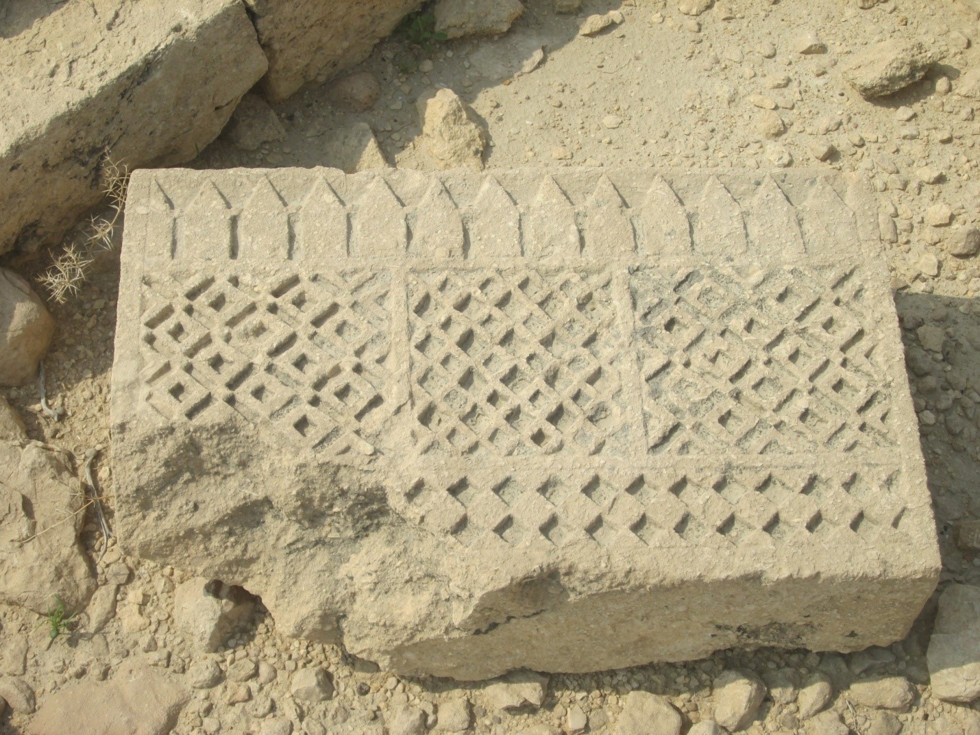 Carved stone slab with geometric motifs - Sindh Courier