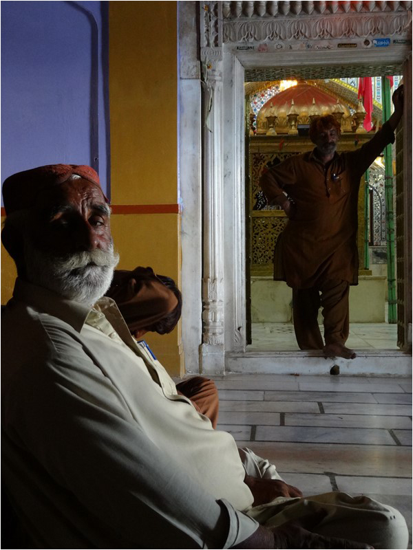 Devotees at the shrine of Jhulelal or Shaikh Tahir