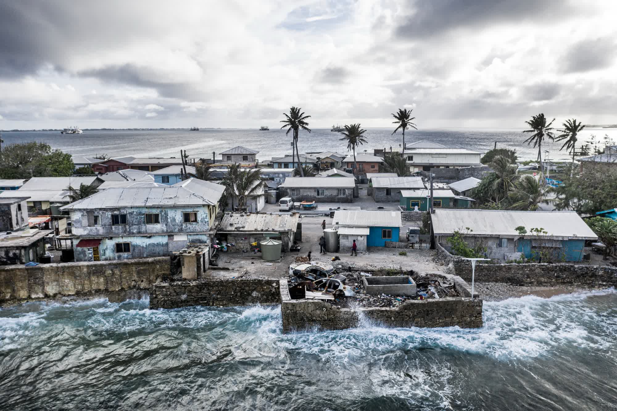 Waves crash into a sea wall in Majuro in April 2019