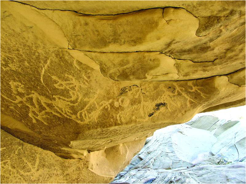 Petroglyphs of dancers, archers and fighters at Beelo Kumb, Seeta valley