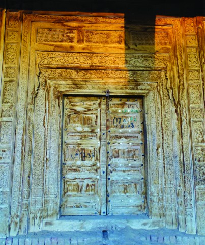 A carved wooden door in the haveli of Chaudhry Shahwali Khan