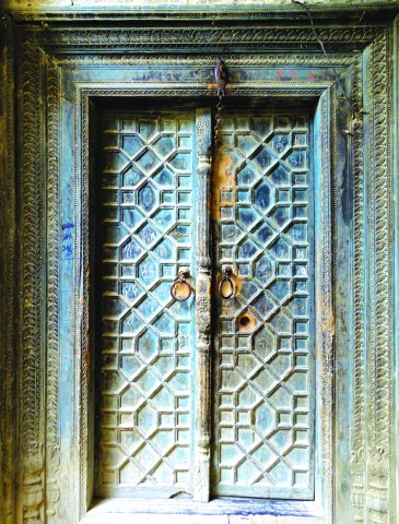 Wooden carved door in a haveli in Makhad