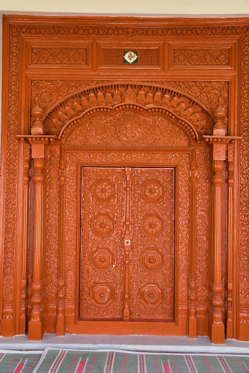 A wooden door in the Madinah mosque in Jasial village