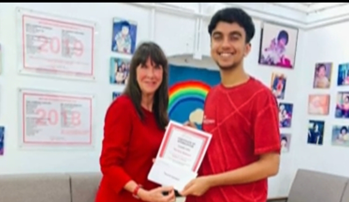 Devesh receiving certificate of recognition