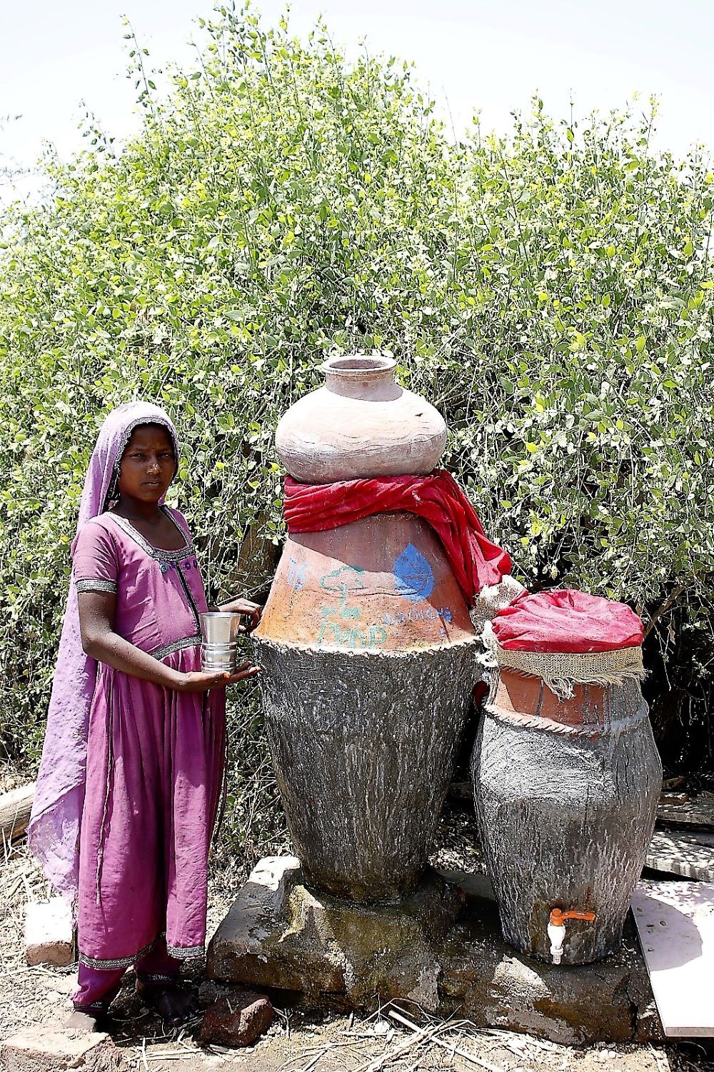 A Kolhi Girl, Standing before her Nadi Filter