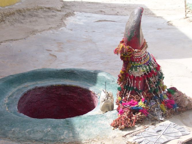 A symbol of Yoni-Lingam, situated on a hill nearby Yak-Thanbhi (one pillared) in Sehwan Sharif