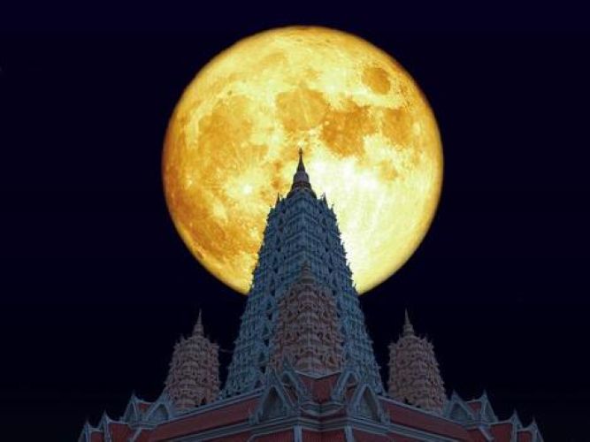 full-blood-moon-over-buddhagaya-pagoda-on-night-sky-photo